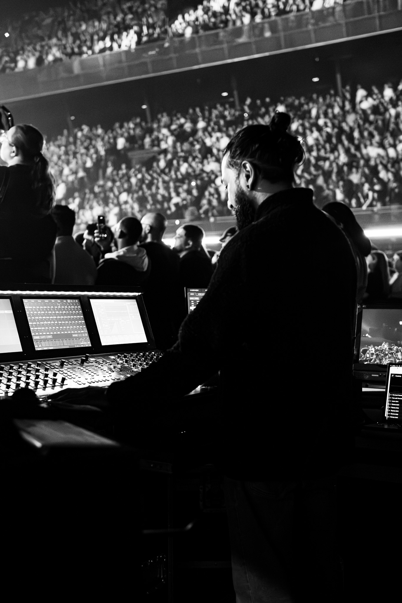 Front of House engineer mixing on a console at a live event