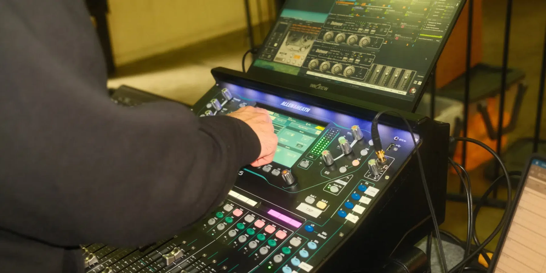 Engineer using an Allen & Heath SQ-Rack